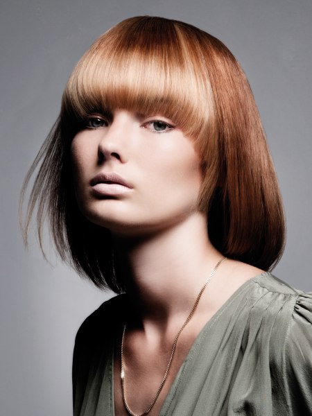 Medium long face framing bob with a tapered cutting line