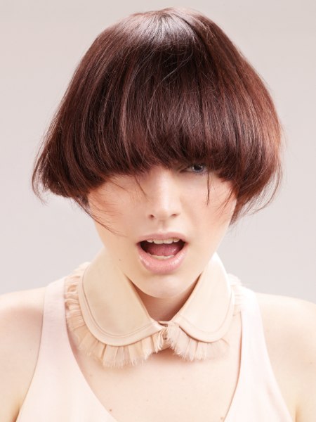 Short haircut with a round shape and long bangs