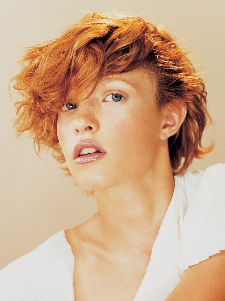 Short red hair with a thick fringe and 80s inspiration