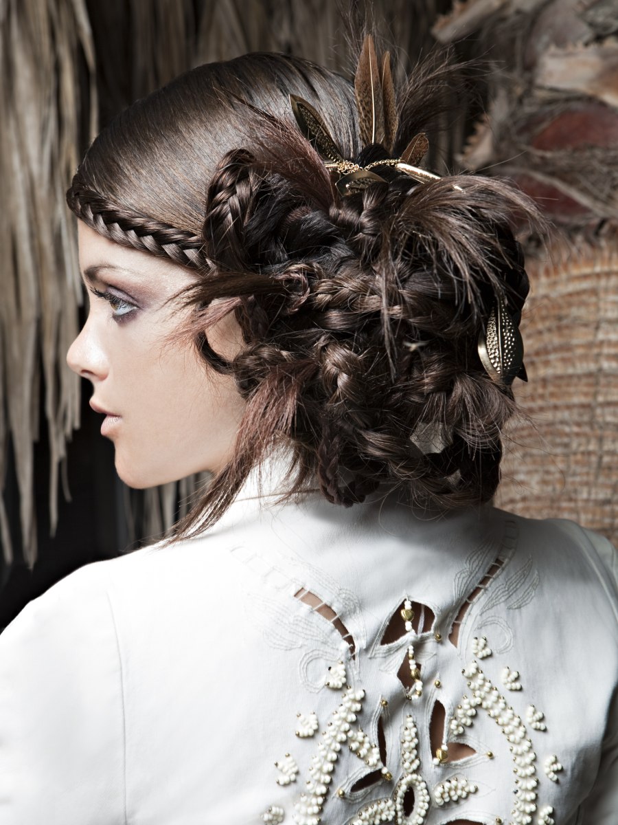 Updo that combines smooth hair, braids and feathers