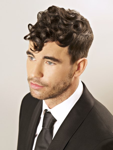 Vintage mens hair with curls and a short clipped back