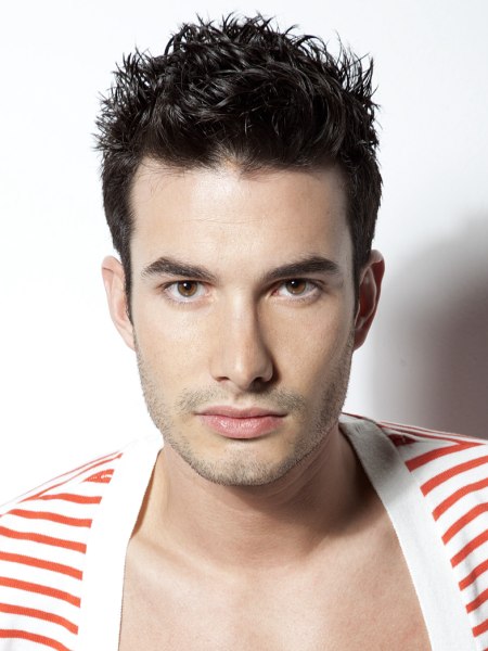 Male haircut with gel-flattened sides and spikes