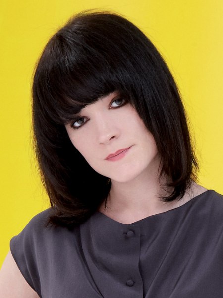 Long, collarbone-length tapered bob with rolled in sides