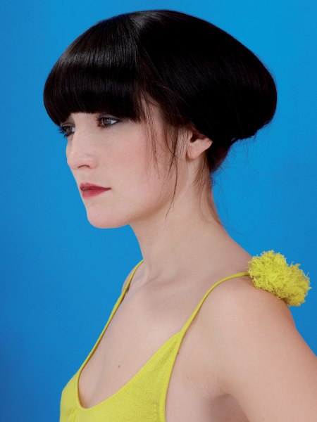 Long bob styled into an Asian-inspired updo