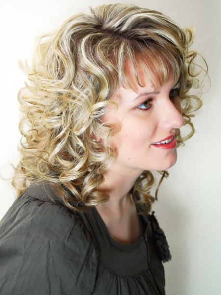 Festive blonde hair style with spiral curls