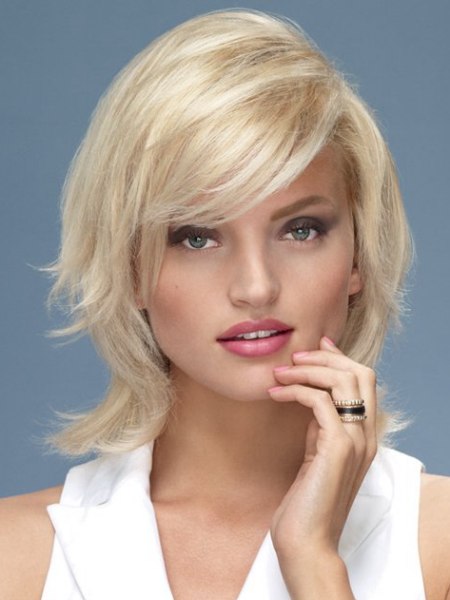 Medium long blonde hair with volume and flipped sides