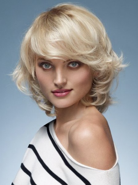 Medium-long blonde hair with curls and a side fringe