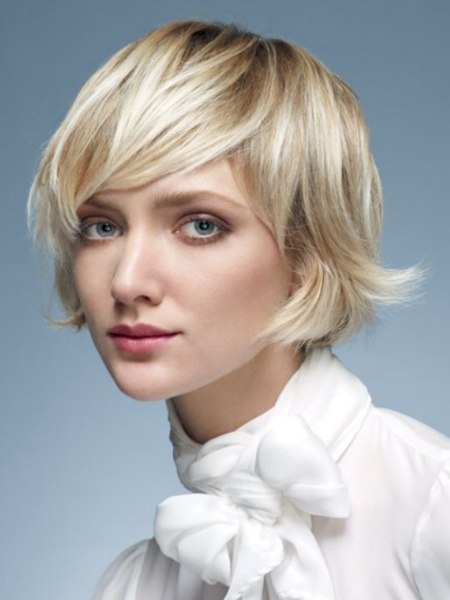 Feminine chin length haircut with flipped out tips