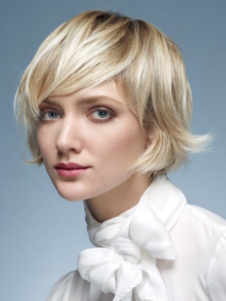 Feminine chin-length haircut with flipped-out tips