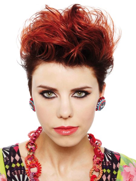 Short flamboyant red haircut with lifted top hair