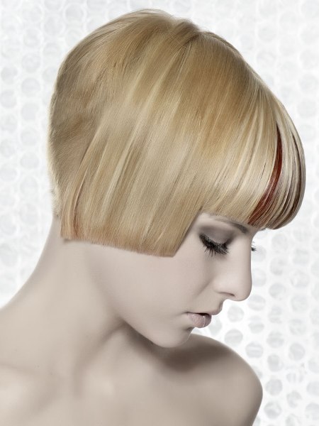 Geometric short haircut with a very short buzzed nape