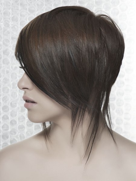 Modern neck length haircut with longer strands - Side view