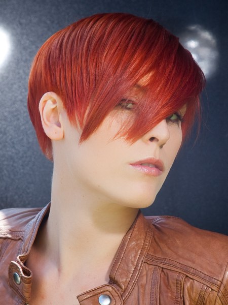 Short layered red hair with a long fringe