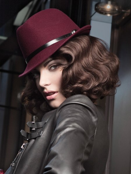 Medium length brown hair with waves and a hat