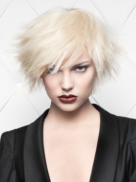 Short blonde haircut with spiky layers, inspired by Andy Warhol