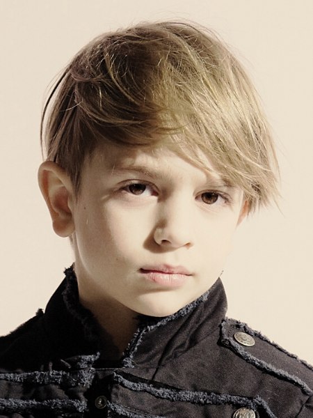 Trendy little boys haircut with a long fringe