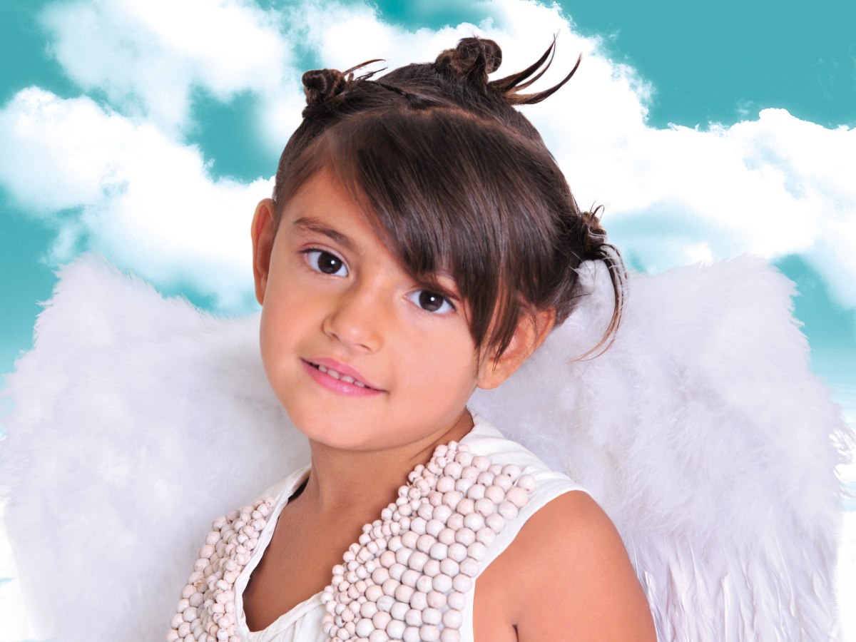 Wonderful Blonde Little Girl In The Image Of An Angel With White Wings.  Angel Kid With Blonde Curly Hair. Angel. Beautiful Child Angel Posing And  Looking At Camera. Stock Photo, Picture and