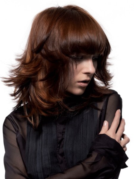Very modern layered haircut with bounce and outward flips