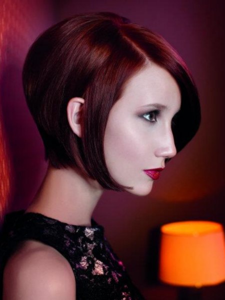 Short cut that follows the jawline for sleek red hair