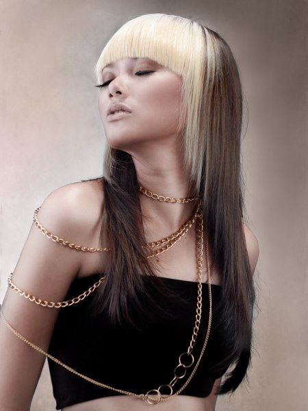 Platinum  blonde and brown hair color combined in one long hairstyle
