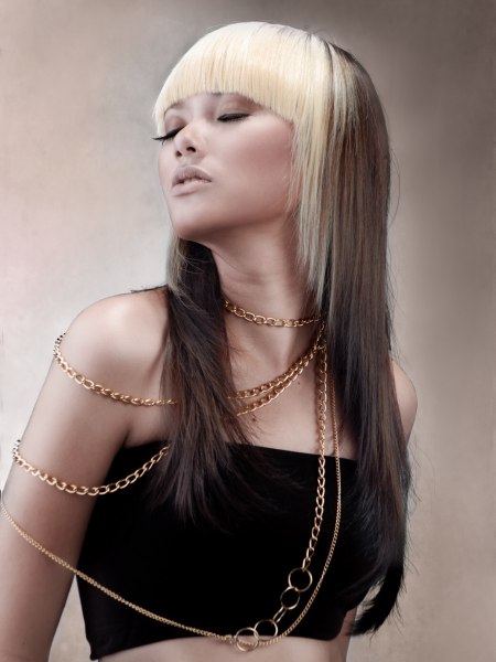 Platinum blonde and brown hair color combined in one long hairstyle