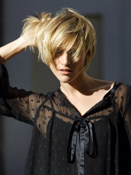 Neat short blonde hair cut based on a bob