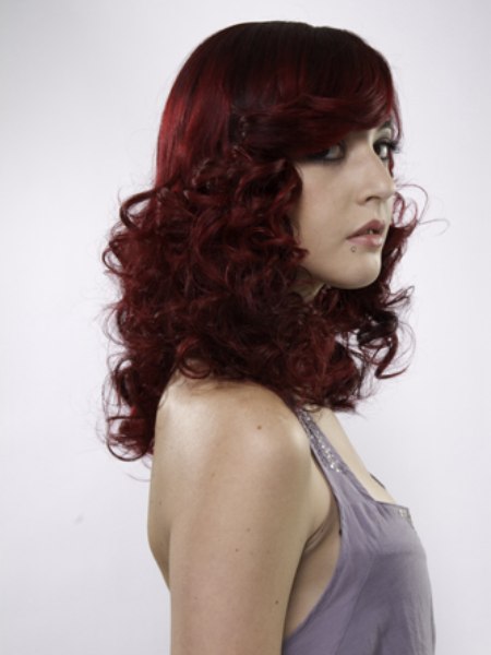 Glamorous long red hair with curls