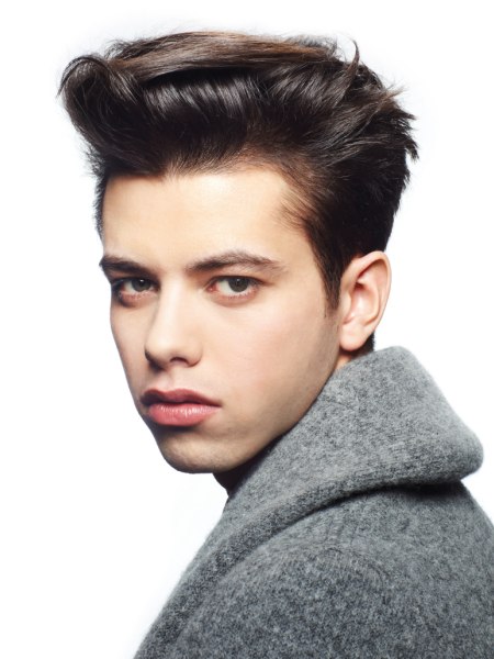 Men's hair with slicked-back sides and a 50s quiff