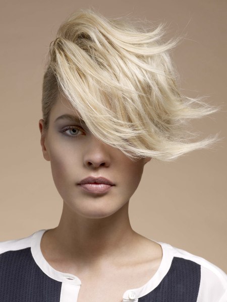 Blonde pixie cut with a free-flowing fringe