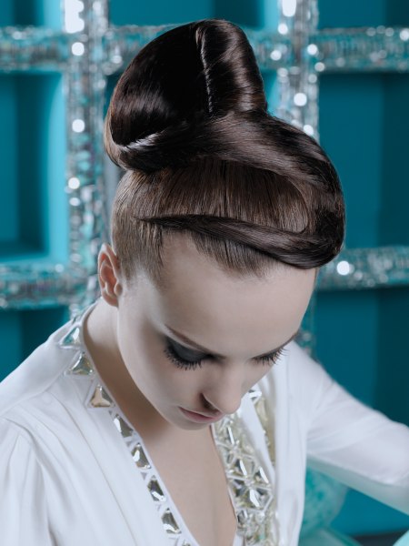 Sleek updo with the hair gathered high
