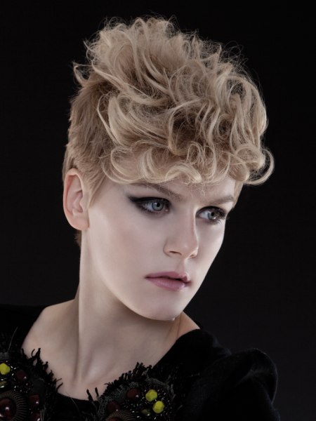 Blonde pixie cut with curls