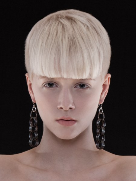 Short blonde haircut with full bangs