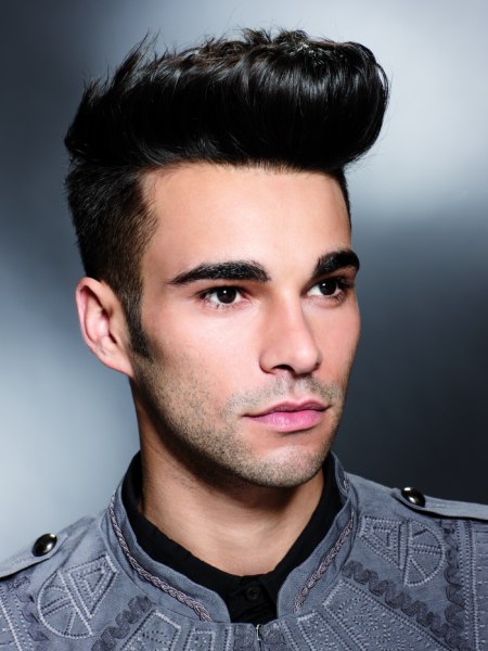 Male haircut with short clipped sides and a quiff