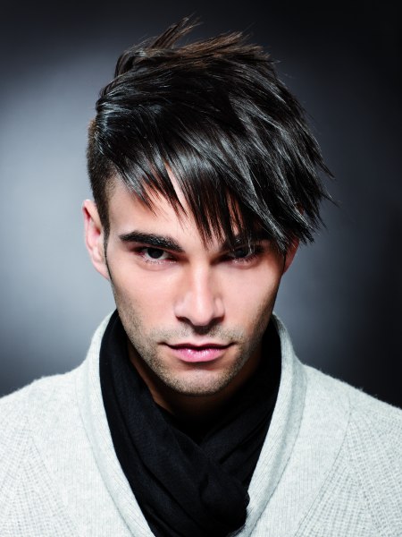 Men's cut with long top hair and wax styling