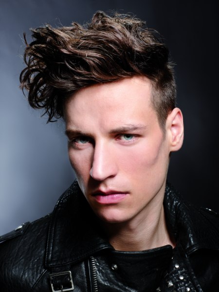 Male haircut with an undercut for wavy hair