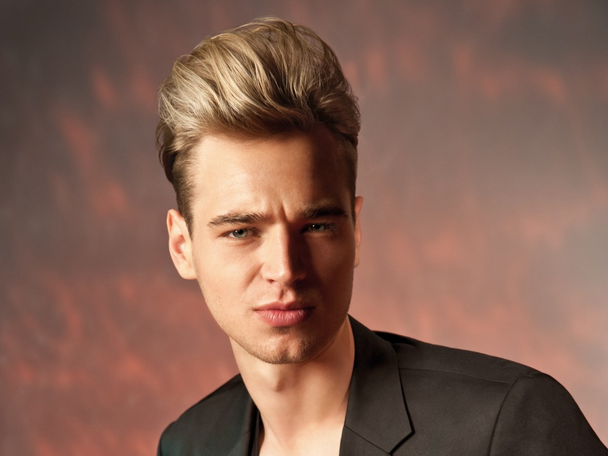 Men's hairstyle for a James Dean look with a high combed 