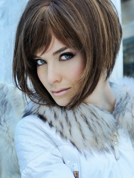 Fashionable angled bob haircut with color streaks