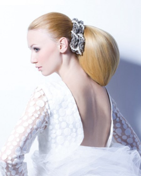 Smooth wedding hair with a ponytail
