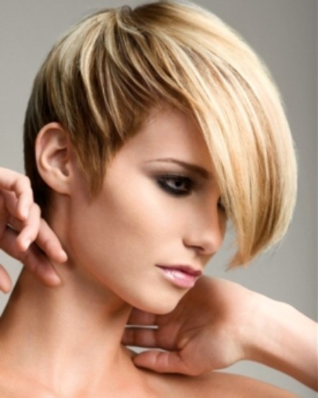 Short gamine hairstyle with a long fringe