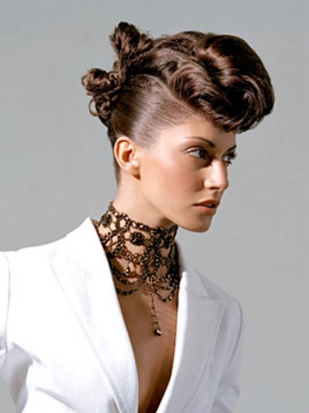 Updo with slick sides and rolls of curls