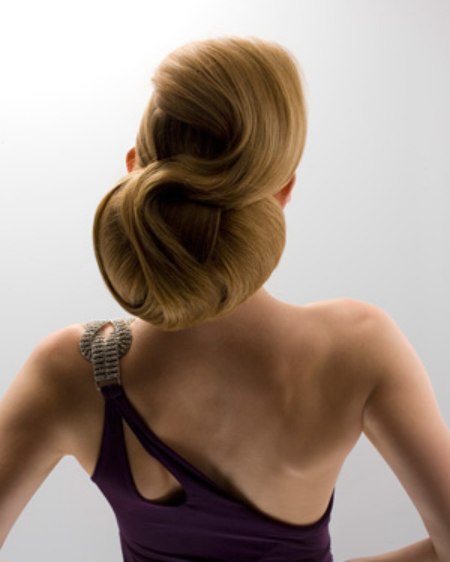 Hair in an updo with a woven knot