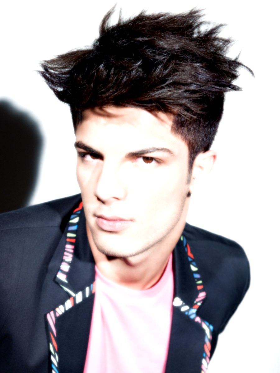 Male punk hairstyle with short sides and a long spiked top