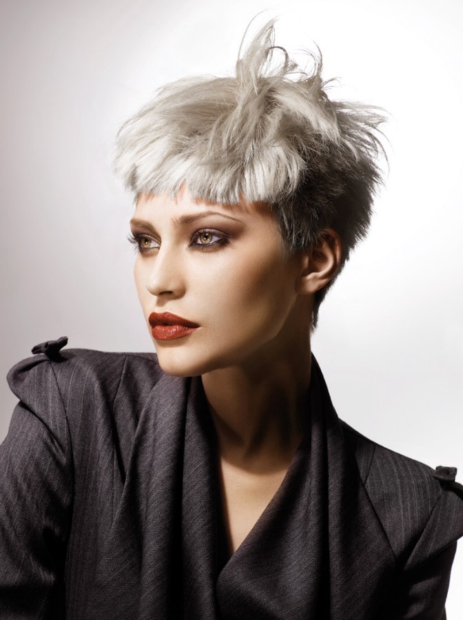 Short Silver Hair With Cropped Sides And Short Bangs 