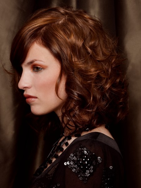 Side view of a shoulder length curled bob