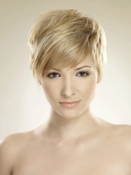 Blonde layered pixie with full bangs
