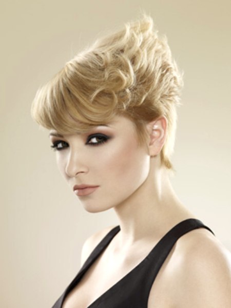 Blonde pixie cut with uprising curls