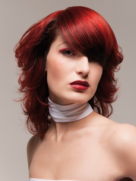 Medium hairstyle with a fire red hair color