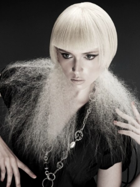 Blonde hair cut and styled for an idiosyncratic look