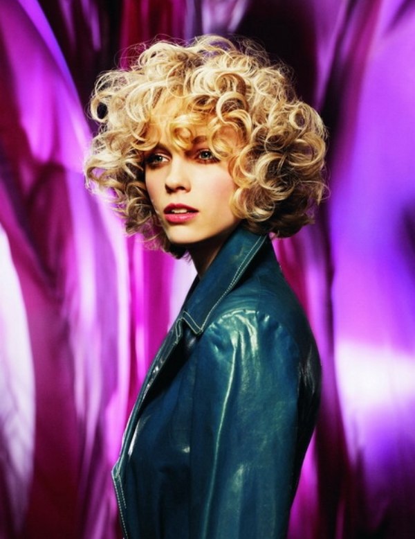 Short hairstyle with blonde bouncy curls around the head