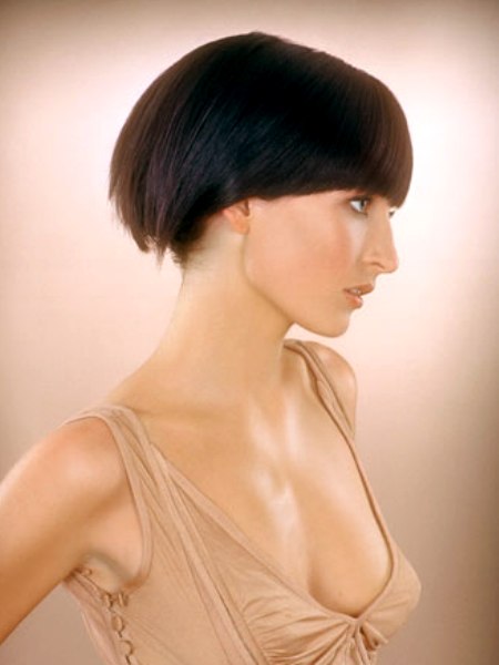 Bluntly cut hair, halfway over the ears